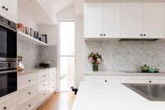 Renovated classic contemporary style kitchen in white and grey tones
